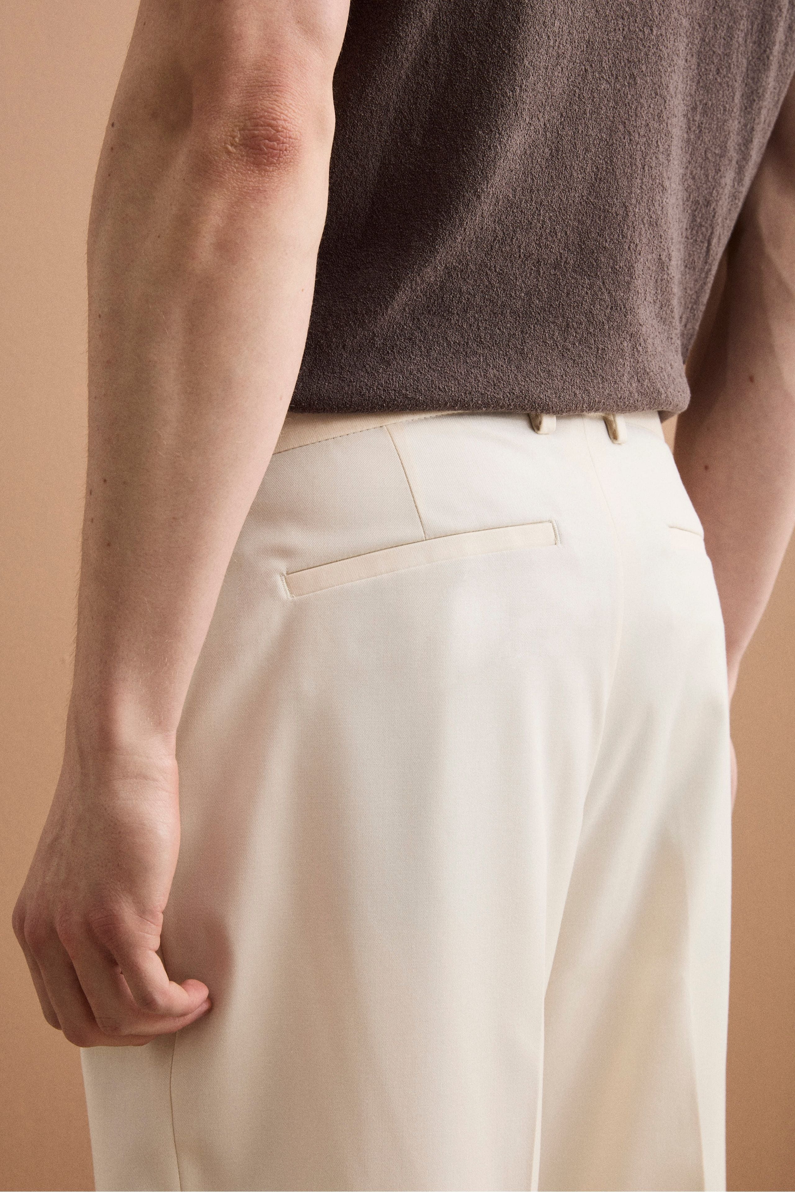 Weite Hose aus Wollmischung mit Bundfalten - Creme weiß