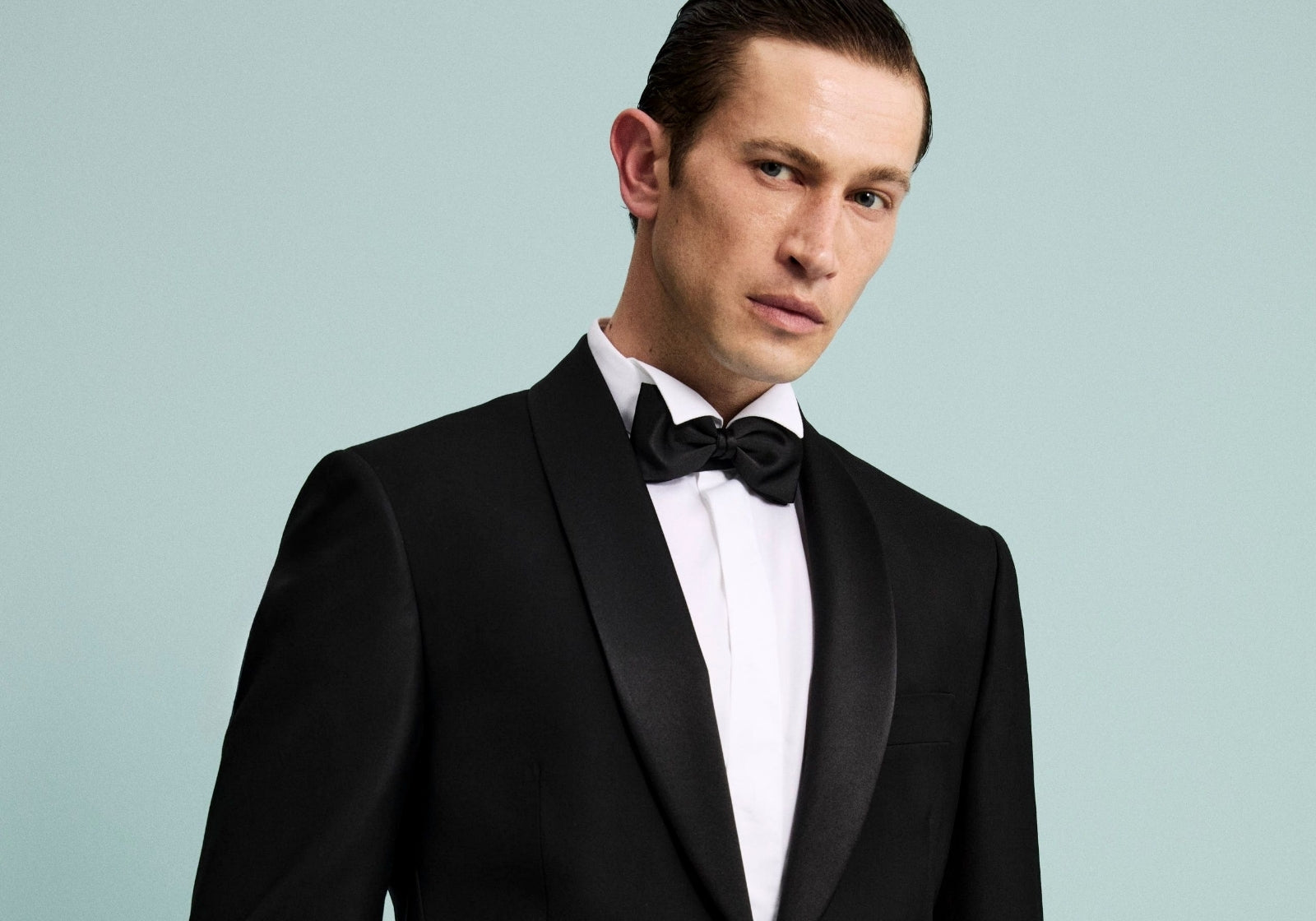 Smoking nero da uomo con papillon