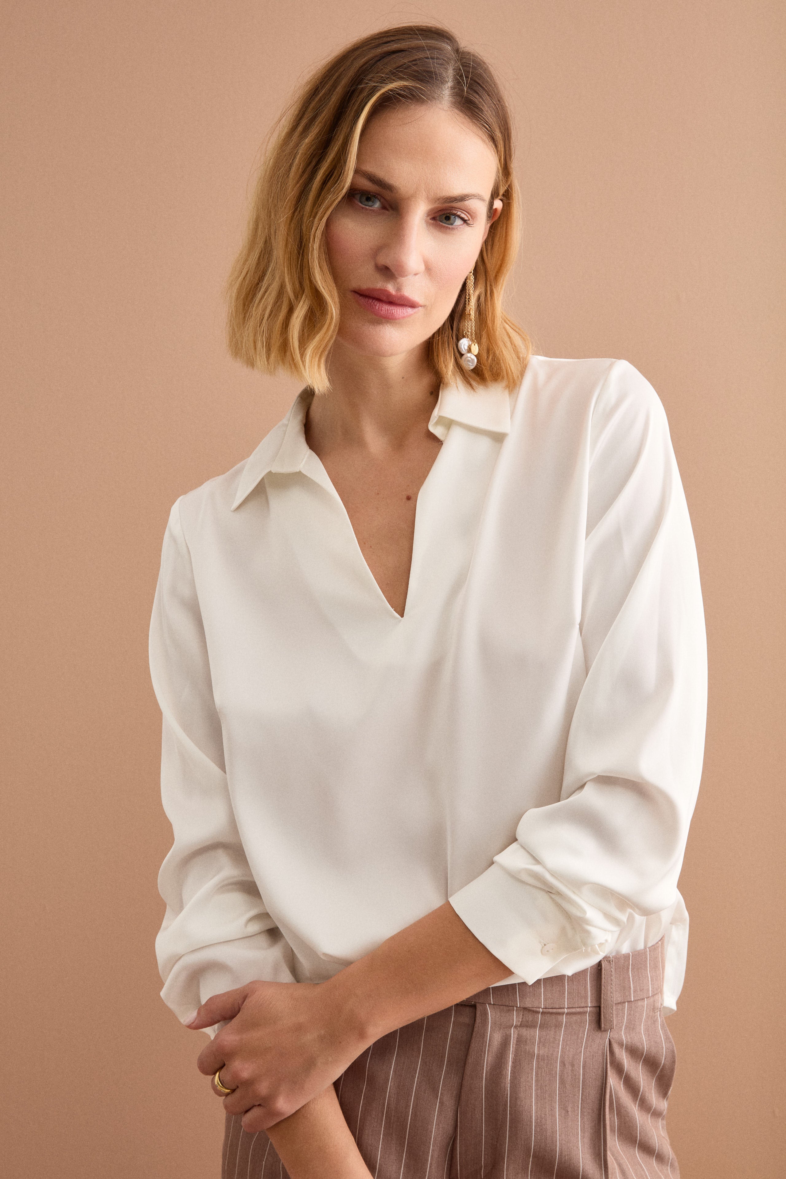 womens cream dress shirt Women's cream-colored cotton shirt with floral embroidery